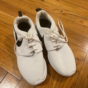 Women’s white and black Nike sneakers